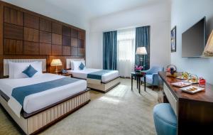 Postel nebo postele na pokoji v ubytování Gewan Hotel Cairo