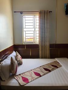 Postel nebo postele na pokoji v ubytování Hong Dao 2 Hotel
