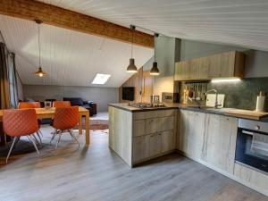 a kitchen and dining room with a table and chairs at Ferienwohnung Annelies - Chiemgau Karte in Inzell