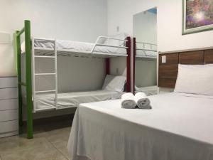 A bunk bed or bunk beds in a room at Pousada Country K