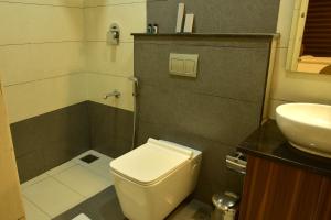 Koupelna v ubytování WHITE SUITE HOTEL