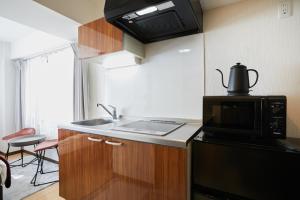 HOTEL AIS HATAGAYAにあるキッチンまたは簡易キッチン