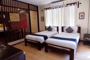 Кровать или кровати в номере Sunny V Hotel