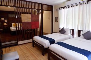 Кровать или кровати в номере Sunny V Hotel