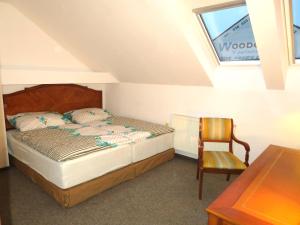 Postel nebo postele na pokoji v ubytování Penzion Pod Černou věží
