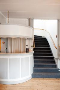 a spiral staircase in a building with a stair case at Reftele Wardshus in Reftele