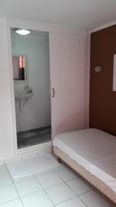 
a bathroom with a toilet and a bath tub at Hotel Du Centre in Saint-Denis
