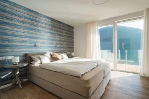 Postel nebo postele na pokoji v ubytování 10 am See - auf der Sonnenseite
