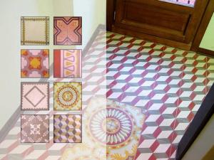 a room with a checkered floor with different colored tiles at Hospedium Hotel Posada De La Luna in Huesca