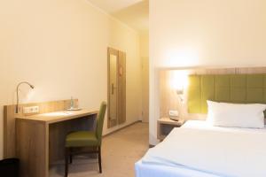 Postel nebo postele na pokoji v ubytování Hermes Hotel Oldenburg