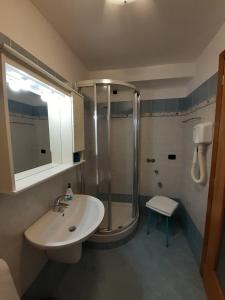 a bathroom with a sink and a shower at Il Patio in Manarola