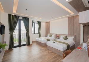 Katil atau katil-katil dalam bilik di Maris Da Nang Hotel & Apartment