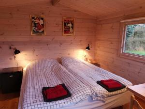 Postel nebo postele na pokoji v ubytování Limfjords hytter