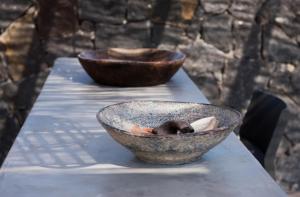 two bowls are sitting on a table at Terra Nera Suites in Perivolos