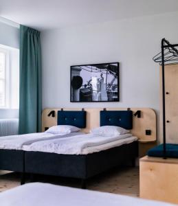 Łóżko lub łóżka w pokoju w obiekcie STF Stockholm Skeppsholmen Vandrarhem
