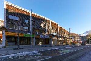 an empty street in front of a building at Vacancéole - Résidence Les Bleuets in Les Deux Alpes