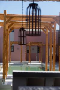 a room with a table and a chandelier at Terra Nera Suites in Perivolos