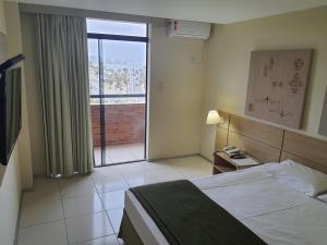 Letto o letti in una camera di Praiabella Hotel