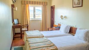 Cama ou camas em um quarto em Hotel Belsol