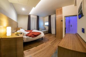 Postel nebo postele na pokoji v ubytování Hotel Firenze