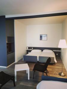 Voodi või voodid majutusasutuse Hotel Fleur-de-Lys toas