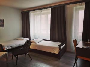 Voodi või voodid majutusasutuse Hotel Fleur-de-Lys toas