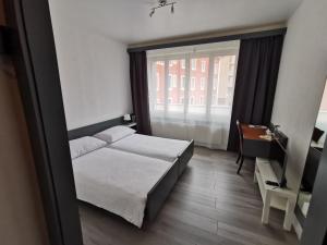 Voodi või voodid majutusasutuse Hotel Fleur-de-Lys toas