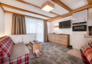 Telewizja i/lub zestaw kina domowego w obiekcie Apartments & Garni Alpenrose