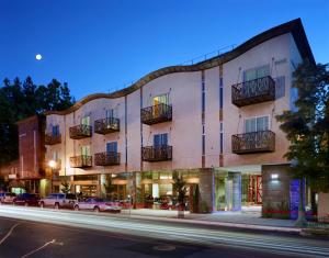 a building on a street at night with cars parked outside at H2hotel in Healdsburg