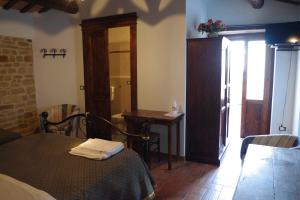 Postel nebo postele na pokoji v ubytování Azienda Agrituristica Colle San Giorgio