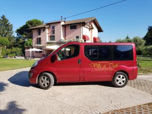 a red truck parked in front of a house at Villa ai Tigli Venezia in Tessera