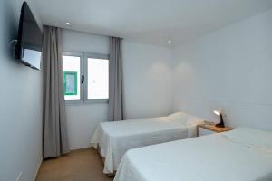 Postel nebo postele na pokoji v ubytování Apartamento Costa Rica
