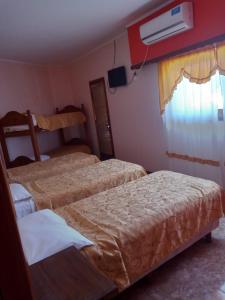 Katil atau katil-katil dalam bilik di Hotel La Palmera