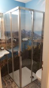 a shower in a bathroom with a view at Haus Binder in Weissensee