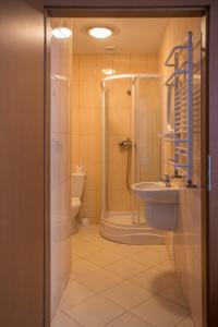 a bathroom with a shower and a sink at Podkowa in Police +37 photos