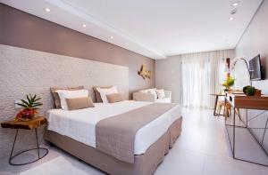 Llit o llits en una habitació de Hotel Real Villa Bella