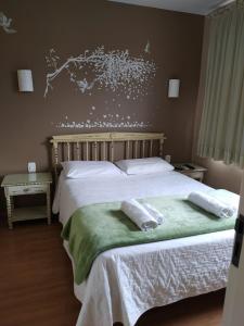 Postel nebo postele na pokoji v ubytování Hotel Domo