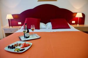 Letto o letti in una camera di Hotel Teti