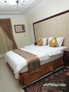 Кровать или кровати в номере Lana Jeddah Furnished Apartments