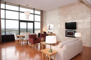 a living room with a couch and a table at The Holman Grand Hotel in Charlottetown