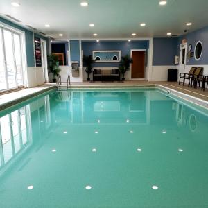 a large swimming pool in a hotel room at Avenue Inn & Spa in Rehoboth Beach