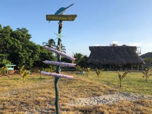 a street sign in the middle of a field at Palmarito Beach Apartamentos in Carretal