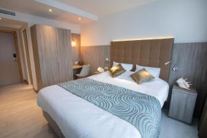 Кровать или кровати в номере Hotel Atlanta Knokke