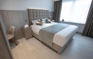 Кровать или кровати в номере Hotel Atlanta Knokke