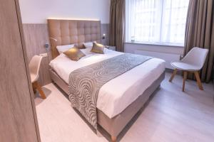 Кровать или кровати в номере Hotel Atlanta Knokke