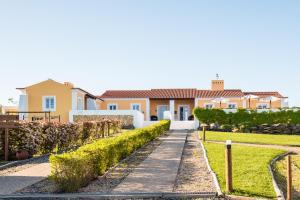a house with a pathway in front of it at Monte do Giestal - Casas de Campo & Spa in Abela