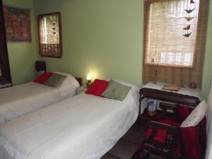 Ένα ή περισσότερα κρεβάτια σε δωμάτιο στο Kiritina´s House Homestay