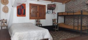 Una cama o camas en una habitación de El Monte de los Abuelos