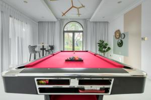 A pool table at Stella Stays Spectacular 4 BDR Palm Villa Beach Private Pool