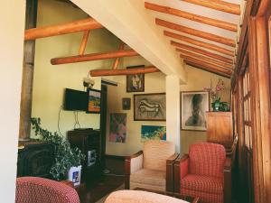 TV a/nebo společenská místnost v ubytování Hostal del Carmen